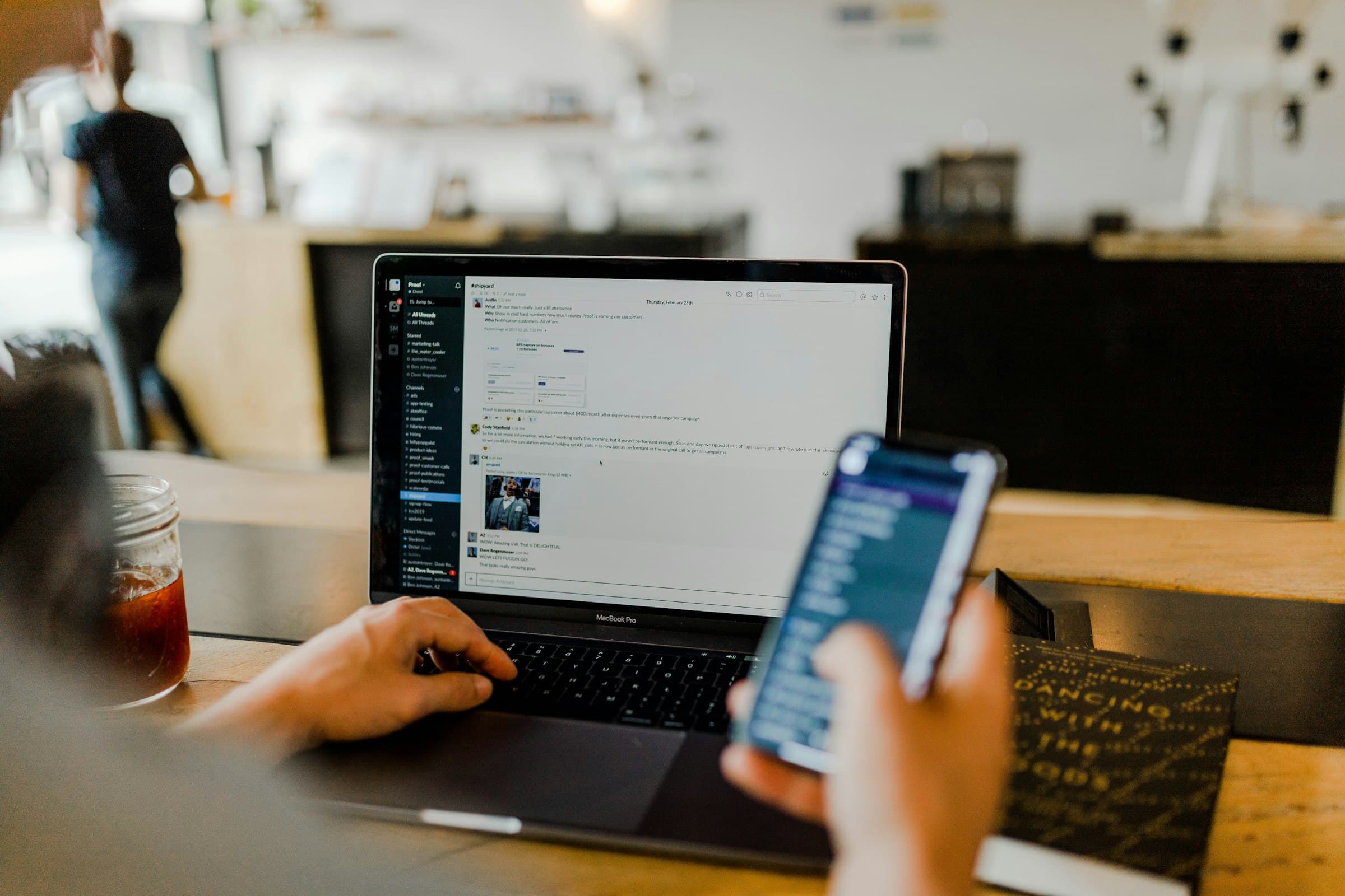 Cybersecurity professional monitoring threat alerts on multiple screens
